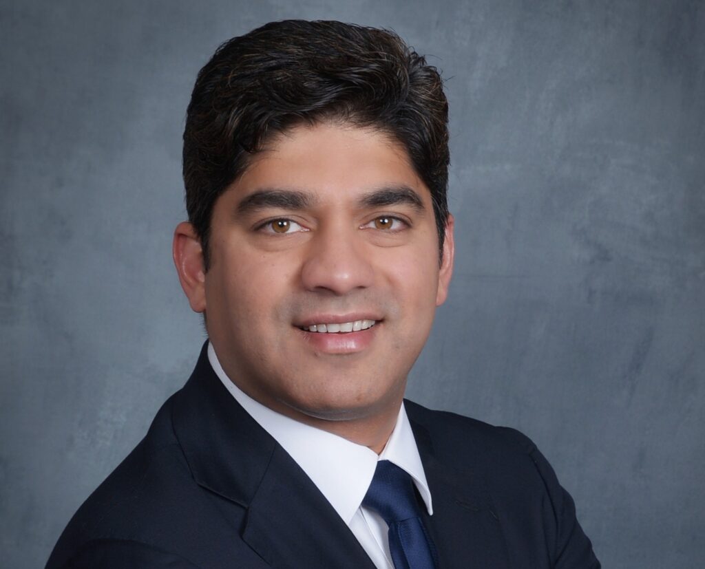 Professional headshot of Rohan Sharma, award-winning AI strategist, keynote speaker, and author specializing in digital transformation and data-driven innovation for Fortune 100 companies