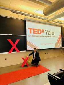 Rohan Sharma, TEDx Yale 2025 speaker and Springer-published author, standing outside Yale Law School after his session on trust and leadership.