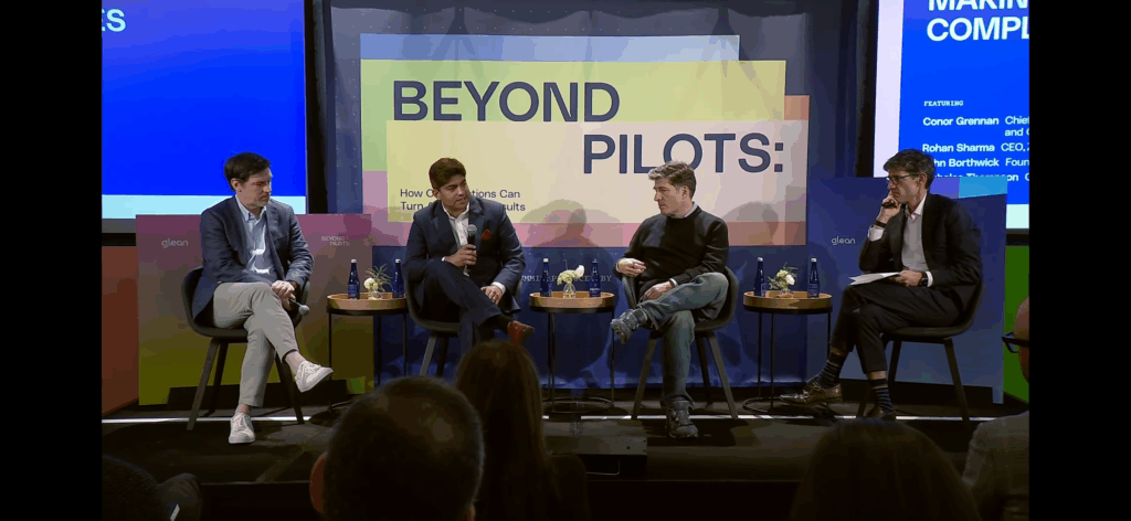 Rohan Sharma (center) speaking about the Trustworthy AI Index on stage with Nicholas Thompson (right) and John Borthwick (left) at The Atlantic CEO Council.